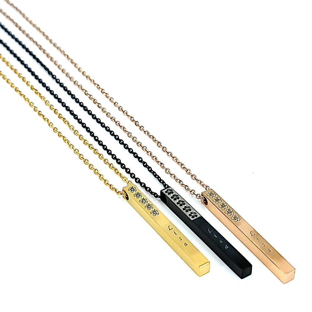 Stainless steel vertical bar pendant engraved with a hibiscus flower