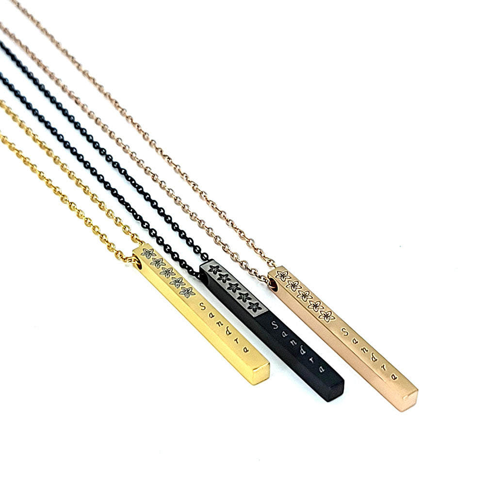Vertical bar pendant in stainless steel with plumeria design and customizable engraving up to 11 characters