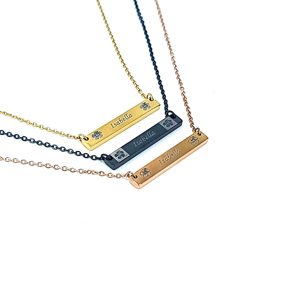 Stainless steel horizontal bar pendant engraved with hibiscus flowers and personalized