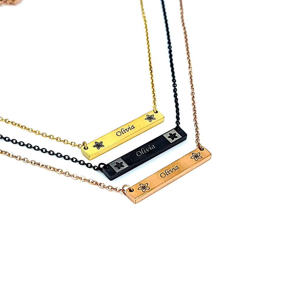 Plumeria engraved horizontal bar pendant in stainless steel with custom engraving