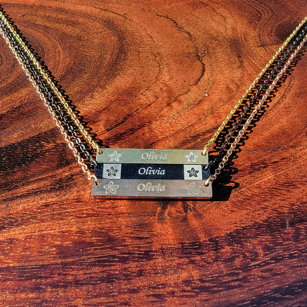 Personalized stainless steel bar pendant with plumeria flower design