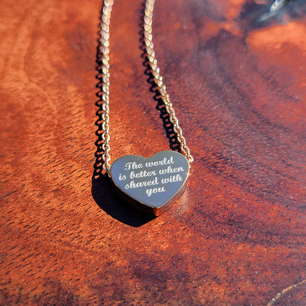 Heart pendant in stainless steel engraved with The World Is Better When Shared With You