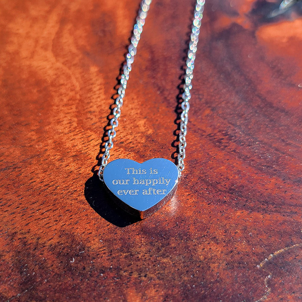 Heart pendant ring in stainless steel engraved with This is Our Happily Ever After