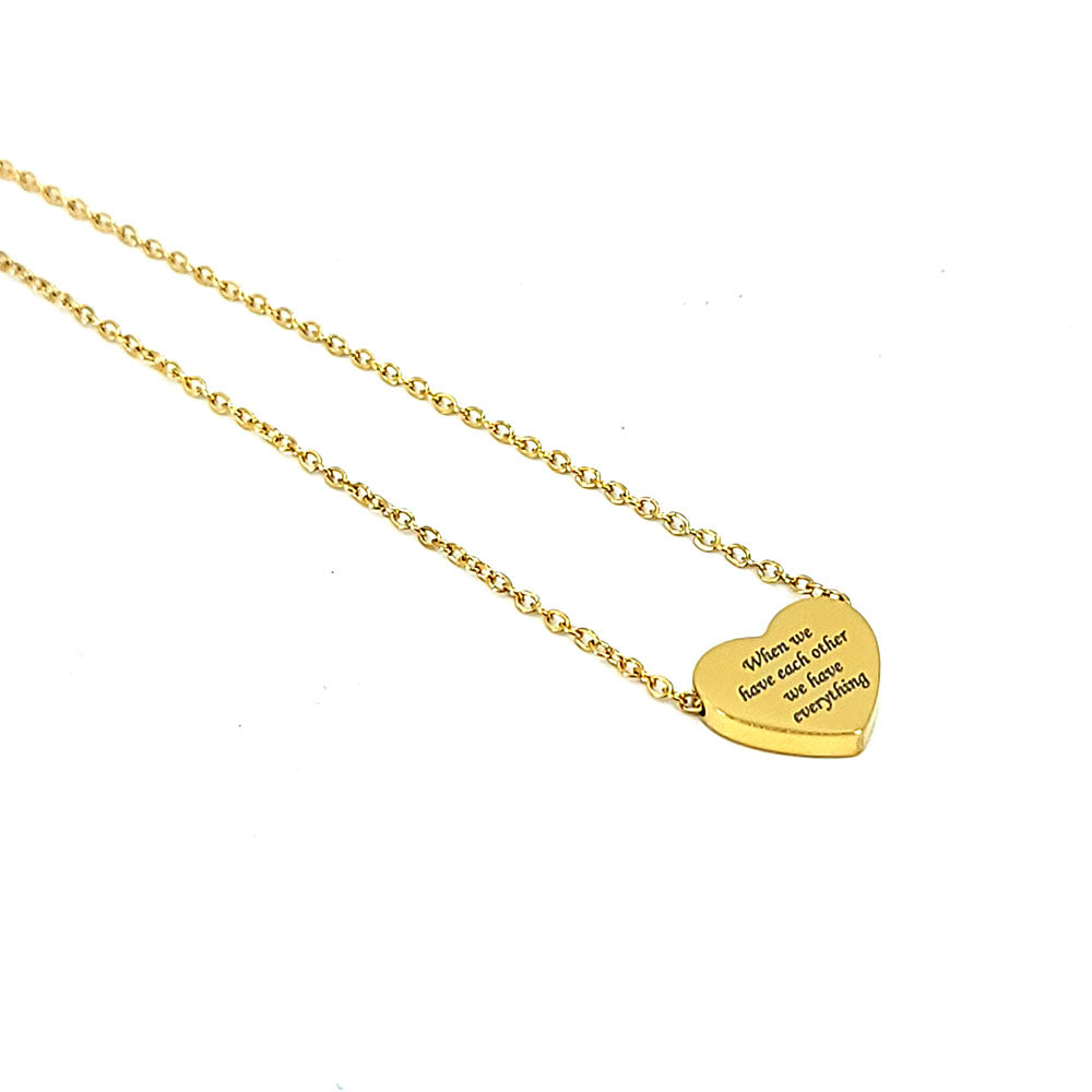 Heart pendant in stainless steel engraved with When We Have Each Other We Have Everything