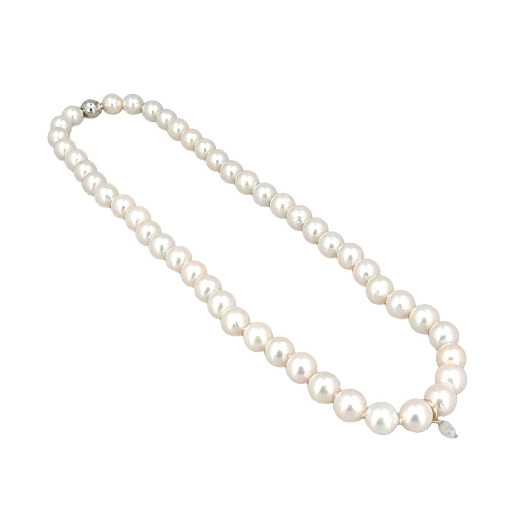 Japanese Akoya pearl necklace featuring 48 white near round 8–8.5mm pearls with a 0.25ct faceted diamond teardrop pendant and a 14K white gold clasp